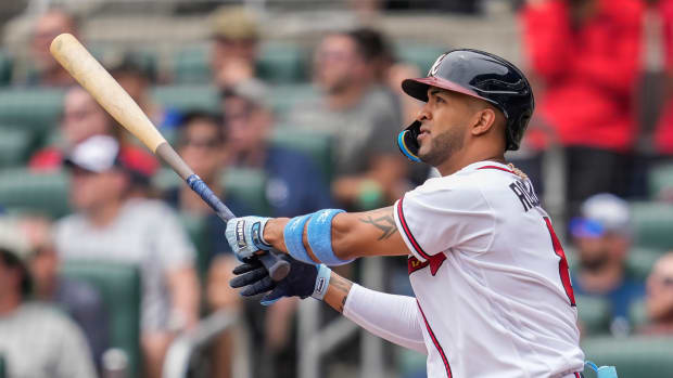 Jun 18, 2023; Cumberland, Georgia, USA; Atlanta Braves left fielder Eddie Rosario (8) watches after hitting a three run home run Colorado Rockies during the second inning at Truist Park.